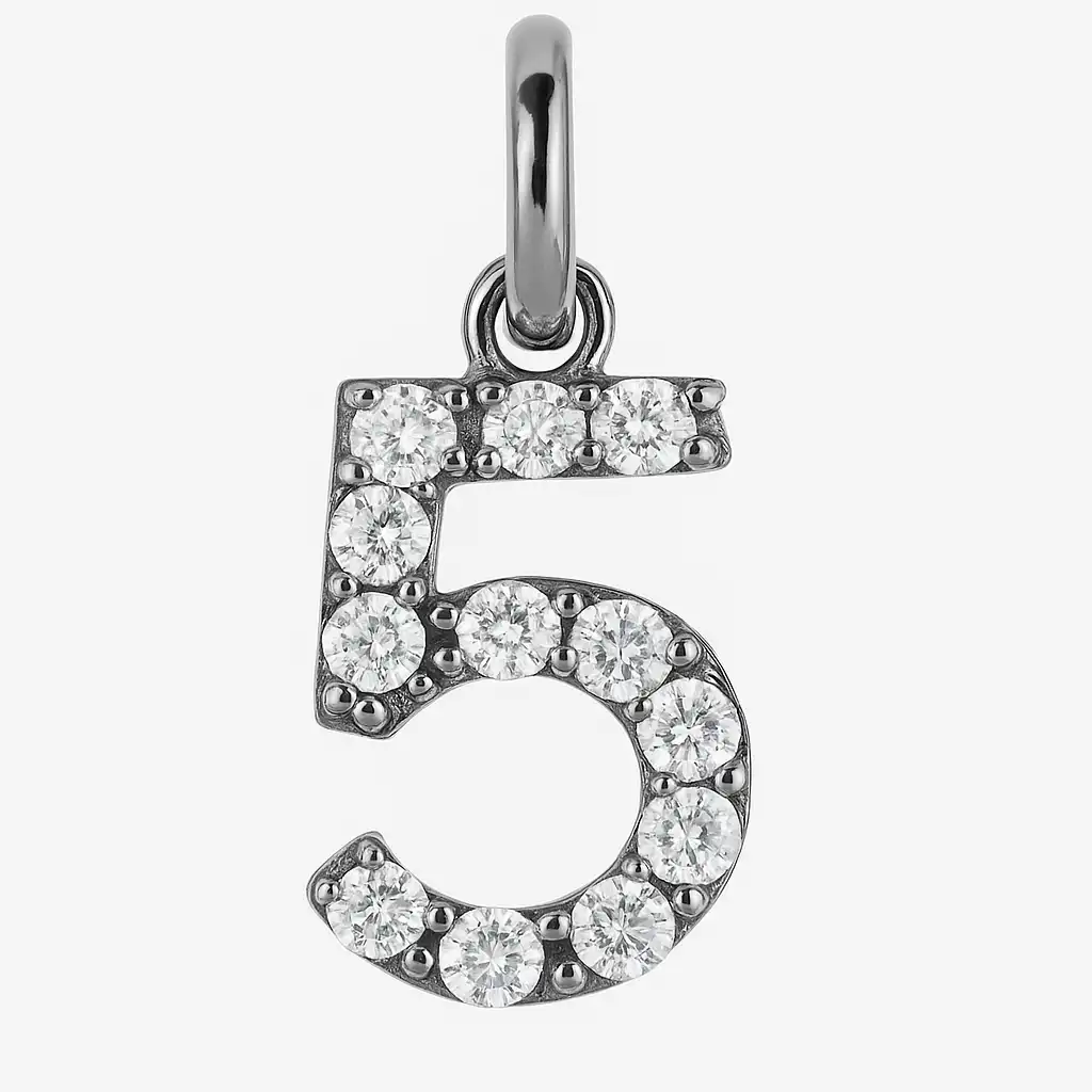 A silver pendant in the shape of the number 5, encrusted with small round diamonds, hanging from a metallic loop against a white background.

