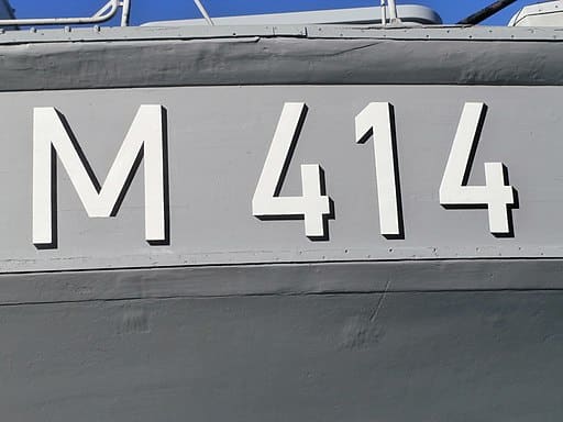 The initials M414 on a boat