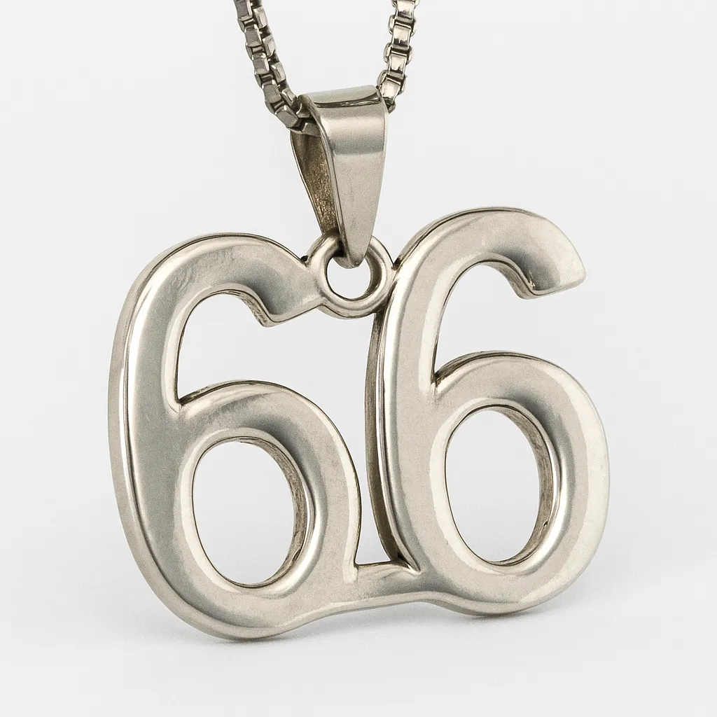 A silver pendant necklace featuring the number 66 rests against a plain white background, symbolizing twin flame energy and spiritual balance.