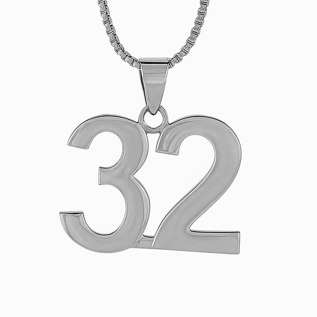 A digital photograph features a silver necklace with a bold number "32" pendant, displayed against a clean white background.