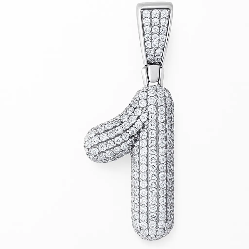 A photograph showcases a sterling silver pendant in the shape of the number 1, encrusted with small sparkling diamonds, hanging from a polished bail.