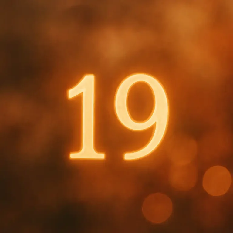 A digital illustration features a glowing golden number 19 set against a soft, dreamy background of light and sparkles, symbolizing spiritual connection and twin flame energy.